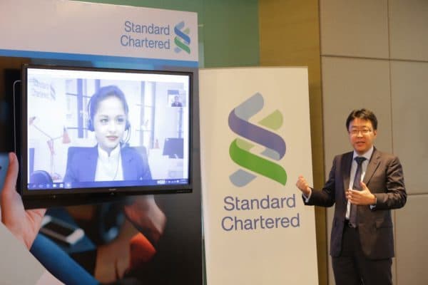 Aaron Loo performing live demo of video banking